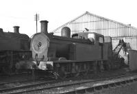Ex-Sligo, Leitrim and Northern Counties Railway 0-6-4T No. 27 <I>Lough Erne</I> still in reasonable condition on York Road shed in December 1969, having been withdrawn from shunting duties earlier that year. Contrary to appearances, the loco was built as late as 1949, although the basic design was some 45 years older.<br><br>[Bill Jamieson 06/12/1969]