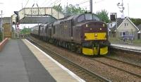 Compass tours ran the 'Oban & Lorn Highlander' tour from Ayr to Oban and return on 6 June 2012. Here West Coast Rail Co's 37676+37516 power through Barassie station having just left Ayr.<br><br>[Ken Browne 06/06/2012]