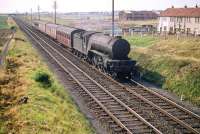 A V2 drifts  down the bank towards Saughton Junction in July 1959 with a train for Waverley.<br><br>[A Snapper (Courtesy Bruce McCartney) 25/07/1959]