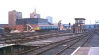 A DMU approaching Doncaster from the south in 1976. The tower of the 1858 Church of St James, funded primarily by shareholders of the Great Northern Railway, stands in the left background. <br><br>[Ian Dinmore //1976]