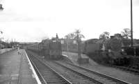 A southbound train hauled by an unidentified 'Clan' Pacific calls at Beattock on 14 July 1962. One of Beattock shed's banking locomotives is standing alongside in the bay.<br><br>[R Sillitto/A Renfrew Collection (Courtesy Bruce McCartney) 14/07/1962]