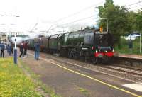 Ex-LMS Coronation pacific no. 46233 <I>Duchess of Sutherland</I> rushes the 1Z33 'Royal Scot' railtour from Carlisle to Milton Keynes through Leyland during a dull evening on 9 June 2012.<br><br>[John McIntyre 09/06/2012]