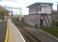 Macclesfield was considered to be a very modern station when rebuilt in the 1960s [see image 38999], but still has some pleasantly old fashioned features in 2012. The signal box is still operational, while the sand drag visible beyond it is the East end stub of the former secondary route to Manchester via Bollington, cut back to Rose Hill Marple in 1970.<br><br>[Ken Strachan 12/05/2012]
