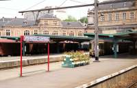 Passing through Verviers Central, Belgium, on a train from Cologne to Ostend in July 1990. A two car local emu (unit 059) can be seen at the adjacent platform.<br><br>[John McIntyre /07/1990]