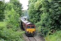 66127 accelerates the 14 bitumen empties away from Strand Road level crossing towards the 1:29 incline to the main line. The thrice weekly train from Preston Dock to Lindsey was photographed from above the Fishergate Hill tunnel portal [see image 20278] at the start of its <I>coast to coast</I> journey. <br><br>[Mark Bartlett 11/06/2012]