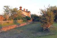 The closed station at Harmston - on the former Lincoln to Grantham direct line, closed in 1962. View looks south from the old level crossing in May 2012. <br><br>[Mark Bartlett 22/05/2012]