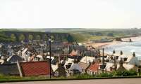 View west over the town of Cullen in May 2012. The viaduct once carried the Moray Coast line towards Portnockie in the distance on the other side of Cullen Bay. [See image 39206]<br><br>[John Furnevel 23/05/2012]