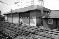 What was once the new signal box at Wallneuk Junction, shorn of its top storey. Seen here from a passing train in June 2012. [The 'signal box' was called 'Paisley' when it opened. It originally had a top floor with windows to view the lines, but when Glasgow took over control that floor was removed and a new roof put on.]<br><br>[Colin Miller 01/06/2012]