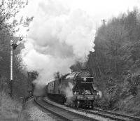 <h4><a href='/locations/M/Melling_Tunnel'>Melling Tunnel</a></h4><p><small><a href='/companies/N/North_Western_Railway'>North Western Railway</a></small></p><p><I>Flying Scotsman</I> bursts out of Melling Tunnel and passes Wennington up distant while working the GMRS special of 24th April 1976 on its return from Carnforth to York. 49/132</p><p>24/04/1976<br><small><a href='/contributors/Bill_Jamieson'>Bill Jamieson</a></small></p>