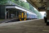 On a dull and wet evening in June 2012, unit 158872 calls at Hebden Bridge with a service from Leeds to Manchester Victoria. The station retains many original features and, if it wasn't for the Class 158 and PIS displays, the photograph could well have been taken 50+ years ago.<br><br>[John McIntyre 16/06/2012]