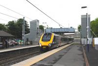 The new passenger lifts installed onto the existing footbridge at Alnmouth, photographed in June 2012. Useful but not exactly pretty. A down CrossCountry service heads for Edinburgh [see image 5268]. <br><br>[Brian Taylor 15/06/2012]