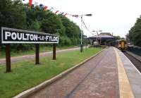 A Blackpool - York service makes the first stop on its journey east on 16 June 2012. The attractive (even on a dull day) station of Poulton-Le-Fylde receives much attention from the Friends group and a replica station nameboard has now appeared there.<br><br>[John McIntyre 16/06/2012]