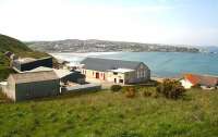 Looking over the former Macduff station in May 2012. Closed in 1951 the refurbished building is now a shop specialising in watersports accessories. [See image 30079] The old locomotive shed, now in use as a storage facility, still stands in the left centre background.<br><br>[John Furnevel 23/05/2012]