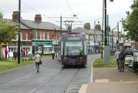 Fleetwood Ash St tramstop, or as it is now know since refurbishment <I>Fisherman's Walk</I>, normally only sees through services to and from Fleetwood Ferry but on the afternoon of 16th June it was Fleetwood Carnival and services from Blackpool terminated here. <I>Flexity</I> 010 uses the crossover to run into the Blackpool bound platform and return to Starr Gate. <br><br>[Mark Bartlett 16/06/2012]