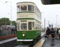 The Olympic flame on board Blackpool tram 147 at Rossall School tram stop during part of its round Britain journey on 22 June 2012. It had originally been planned to use the open topped 'boat' tram for the occasion but the weather unfortunately put paid to that idea.<br><br>[John McIntyre 22/06/2012]