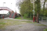 The northside entrance to Brampton station, Cumbria, looking west in May 2006. The footpath straight ahead is the trackbed of the line that ran to Brampton Town, over a mile away, which closed to passengers in 1923. Brampton station was originally opened as Milton in 1836 since when it has undergone name changes to both Brampton Junction (twice) and plain Brampton (three times).<br><br>[John Furnevel 06/05/2006]