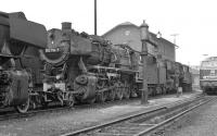 DB Class 50s at Schwandorf MPD in August 1974. No. 052 794 with 050 <br>
737 behind. The class 217 B-B diesel hydraulic standing on the right <br>
was one of a small class of only 15 locos built in the late 1960s. As <br>
of late 2011, four of them were still in service on freight work from <br>
Mhldorf, although 217 018 was not one of them.<br><br>[Bill Jamieson 25/08/1974]