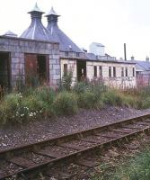 The former Towiemore Halt on the Dufftown branch in 1977, some 9 years after closure. Note the grounded coach body.<br><br>[Ian Dinmore //1977]