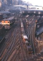 J37 goods pilot No. 64624 moves a train east towards the Calton Tunnel on 12th August 1961. Part of the long elevated walkway linking Jeffrey Street and Calton Road can be seen in the left background, while the condition of the station's end screens bears witness to the number of steam locomotives that have passed this way over the years.<br><br>[Frank Spaven Collection (Courtesy David Spaven) 12/08/1961]