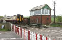 The 10.00 Stranraer Harbour - Newcastle Central ScotRail service passing Brampton Fell level crossing, Cumbria, in May 2006, just under half a mile short of Brampton station.<br><br>[John Furnevel 06/05/2006]