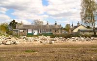 Broadside view of Nethy Bridge station looking east on 21 May 2012. Clearance and demolition activity in the foreground is in connection with a new housing development.<br><br>[John Furnevel 21/05/2012]