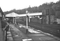 <h4><a href='/locations/G/Galashiels_1st'>Galashiels [1st]</a></h4><p><small><a href='/companies/E/Edinburgh_and_Hawick_Railway_North_British_Railway'>Edinburgh and Hawick Railway (North British Railway)</a></small></p><p>The 'Scottish Region Grand Tour No. 6' is about to depart from Galashiels at 10.15 on 4th January 1969. This view looking north-west from the train is utterly unrecognisable today with the houses on the skyline forming the only man-made features which still survive, and these will be totally obscured by  foliage in summer. Station Brae Bridge, designed by consulting engineers Blyth & Blyth in the 1930s, carries the road to Melrose over the station.</p><p>04/01/1969<br><small><a href='/contributors/Bill_Jamieson'>Bill Jamieson</a></small></p>