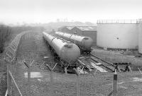 The oil sidings at Hawkhead, to the east of Paisley, in February 1990. From here aviation fuel was supplied to Glasgow Airport via a pipeline. View east towards Glasgow, with the Paisley Canal line running past on the left.<br><br>[Bill Roberton 24/02/1990]