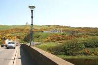 Crossing the River Deveron heading east on the A98 between Banff and Macduff in May 2012. The former Banff Bridge station stands on the hillside in the centre background. [See image 39065]<br><br>[John Furnevel 23/05/2012]