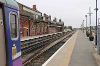 Although the main entrance, buffet and ticket office at Cleethorpes lie behind the buffers this fine array of station buildings is on Platform 1.  This view in May 2012, looking past the Barton-on-Humber <I>Bubble Car</I>, is towards the station throat and the single line section to Grimsby.<br><br>[Mark Bartlett 21/05/2012]