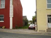 A gate post still in place on the west side of Water Street on the former route to Pembroke Dock, looking to Gordon Street level crossing with the station approximately 50 metres behind the camera.<br><br>[David Pesterfield 23/05/2012]