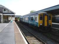 153312 and 150279 stand at Tenby on 23 May during token exchanges whilst working the 14.00 Swansea - Pembroke Dock and the 15.09 reverse service.<br><br>[David Pesterfield 23/05/2012]