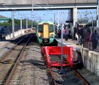 The stock for the 15.13 to Selhurst (377.202 leading) arrives in platform 2a at Milton Keynes Central in this colourful scene captured on 28th June 2012.<br><br>[Ken Strachan 28/06/2012]