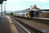 375829 draws to a halt at Deal station on 2 July 2012 with a Southeastern service from Ramsgate to London via Dover. The Deal station area is still mechanically signalled and the signalbox at the north end of the station also controls a level crossing.<br><br>[John McIntyre 02/07/2012]