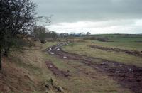 This view looks west at Belston Junction in 1997 during ballast recovery. The line to Rankinston and Dalmellington Ironworks ran straight ahead and that to Ayr curves off to the right.<br><br>[Ewan Crawford /04/1997]