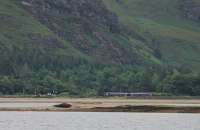 The evening Sunday service from Inverness to Kyle passes tiny Attadale station as it runs alongside the head of Loch Carron. As the 158 ran along the jointed track it could be clearly heard all over the glen.<br><br>[Mark Bartlett 08/07/2012]