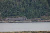 A Kyle bound Class 158 approaches the avalanche shelter near Attadale, as seen from the north shore of Loch Carron. There are only two trains each way on this line on Sundays and this unit will stay at the terminus overnight before forming the early morning service to Inverness on Monday.<br><br>[Mark Bartlett 08/07/2012]