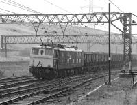 The weather looks to have taken a turn for the worse as  76 051 approaches Dunford Bridge with a westbound coal train in July 1981.<br><br>[Bill Jamieson 17/07/1981]