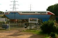 On display at Railworld, Peterborough, is Tracked Hovercraft Ltd experimental vehicle RTV31 and a surviving section of guideway. The system was based on a combination of 2 British inventions, the Hovercraft and the linear induction motor but development work was abandoned in 1973 due to budget cuts.  Photographed on 4 July 2012 from a passing train.<br><br>[John McIntyre 04/07/2012]