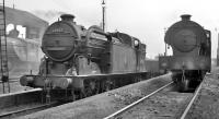 Locomotives in the shed yard at Doncaster, probably photographed in the early 1960s. Condensing N2 0-6-2T no 69592 is a long way from its normal patch around Kings Cross sub and the Metropolitan widened lines, while V2 60880 (left) and J94 68020 are thought to have been 36A residents at that time. <br><br>[K A Gray //]