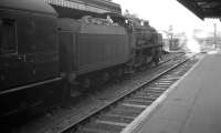 An unidentified locomotive prepares to take a train out of platform 1 at the east end of Salisbury station in the summer of 1961, most likely bound for Southampton or Portsmouth. <br><br>[K A Gray /08/1961]