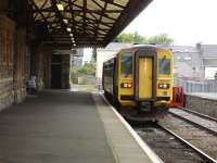 153312 lays over at Pembroke Dock on 23 May before returning to Swansea on the 17.09 service. The line previously continued forward across Water Street and between the houses ahead, before crossing Gordon Street in order to continue along to the dock area [see image 39429].<br><br>[David Pesterfield 23/05/2012]