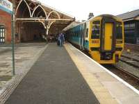 158823 stands at Aberystwyth on 10 May 2012 with the 11.25 arrival from Birmingham International.<br><br>[David Pesterfield 10/05/2012]