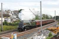 With that distinctive whistle chiming <I>Union of South Africa</I> runs north through Hest Bank on the final leg of a main line test with a full rake of coaches. 60009 had been on a circuit from Carnforth via Hellifield and Blackburn on 18 July with WCRC (ex-Advenza) 57006 on the rear as insurance.<br><br>[Mark Bartlett 18/07/2012]