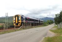 The 1757 Inverness to Kyle service runs alongside the A890 just west of Strathcarron station. 158707 was photographed in between courses at the (recommended) Carron Restaurant that overlooks the line at this point. The unit will stable overnight in Kyle and form the early morning service back to Inverness.<br><br>[Mark Bartlett 13/07/2012]