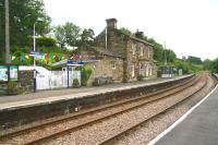 View north west over Glaisdale station on the Whitby line on 11 July 2012. The passing loop is still in use here although Glaisdale signal box is long closed [see image 18784].<br><br>[John Furnevel 11/07/2012]