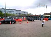 Major improvements to the Milton Keynes station forecourt seen on 12 July 2012. Buses used to be kept to the far side of the line of flagpoles in the background. The shelters for bus and taxi passengers are also welcome - this area has always been rather windswept.<br><br>[Ken Strachan 12/07/2012]