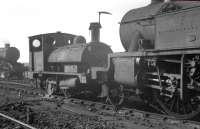 Diminutive ex-L&Y class '21' 0-4-0ST dock tank no 51253 stands out of use on Speke Junction shed, Liverpool, in April 1963. The locomotive was officially withdrawn from here 2 months later.<br><br>[K A Gray 02/04/1963]
