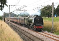 Running like the proverbial <I>well oiled sewing machine</I> 46233 heads south at Woodacre on 21st July 2012 with the returning <I>Cumbrian Mountain Express</I>. The mainly maroon rake of coaches nicely complemented the green 'Duchess'.<br><br>[Mark Bartlett 21/07/2012]