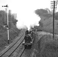 <h4><a href='/locations/W/Wennington_Junction'>Wennington Junction</a></h4><p><small><a href='/companies/N/North_Western_Railway'>North Western Railway</a></small></p><p>On May 1st 1976, <I>Hardwicke</I> and <I>Flying Scotsman</I> spent much of the day on display at Settle before working a second S&C centenary special. This one had originated at Blackburn and enjoyed steam power on the Hellifield to Carnforth leg of its return journey from Carlisle, seen here passing Wennington. As can be seen from the glistening rails, the weather was far from ideal for such an occasion. See image <a href='/img/38/631/index.html'>38631</a> 50/132</p><p>01/05/1976<br><small><a href='/contributors/Bill_Jamieson'>Bill Jamieson</a></small></p>