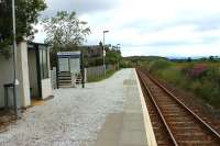 Last stop before Kyle of Lochalsh is Duirinish and this view looks west towards the terminus at the small request stop. Although the shelter has been around for some time both it and the station generally have recently enjoyed a light refurbishment. [See image 10590] for the same location in 1994.<br><br>[Mark Bartlett 10/07/2012]